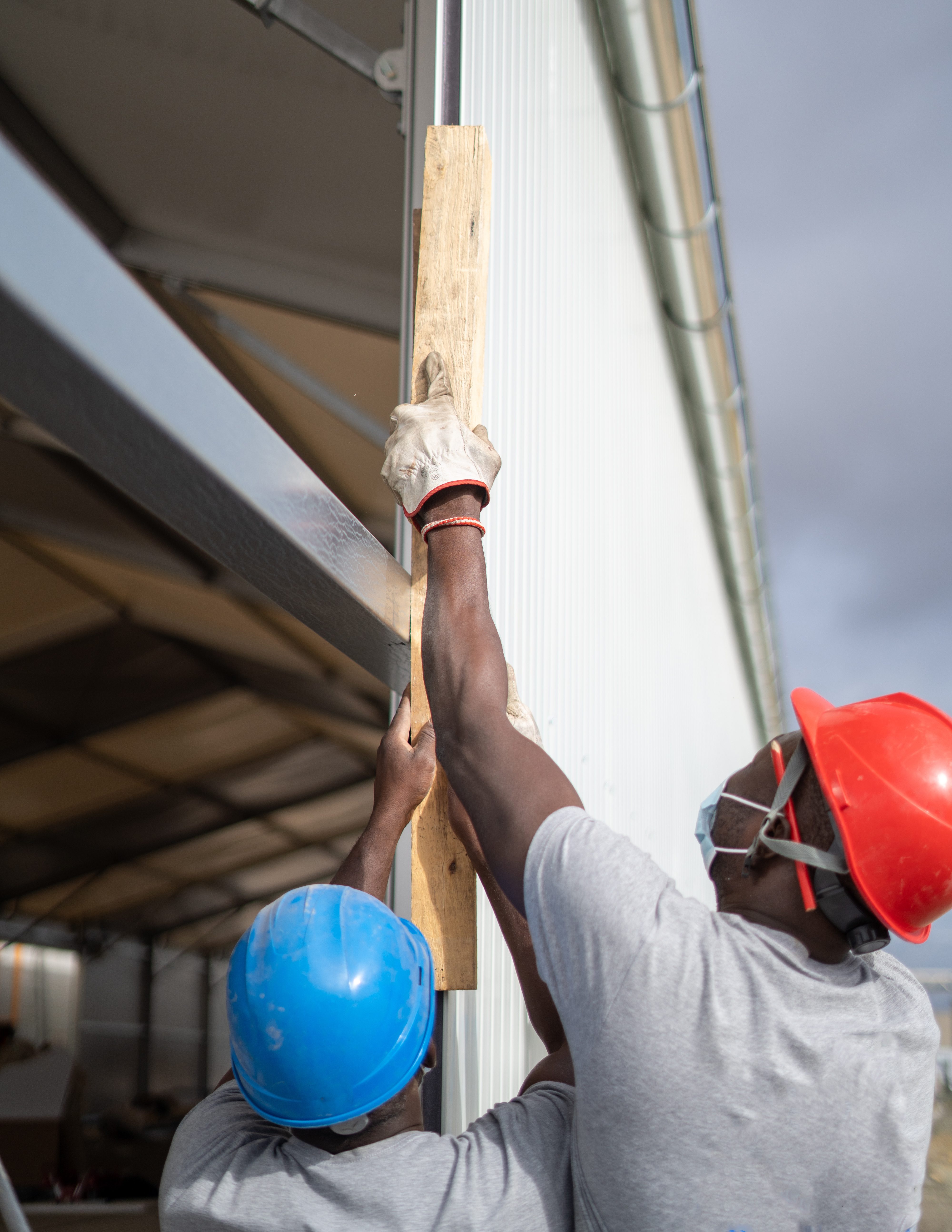 Black men working on the roof 